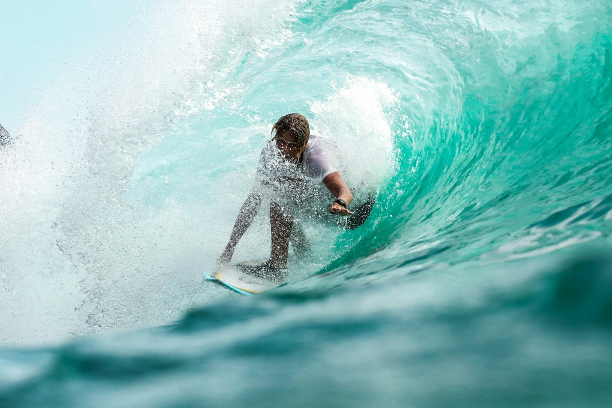 Surfer with bartered board